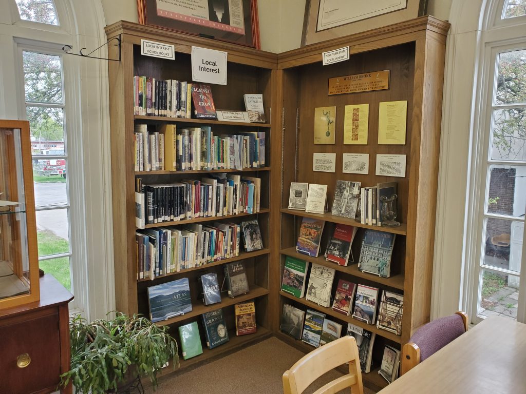 Photograph of corner bookshelves with local interest resources